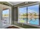 Bedroom with water views featuring roll down shades and access to the balcony at 2708 Port Of Call Dr, Las Vegas, NV 89128