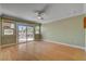 Bedroom features hardwood floors, ceiling fan and access to back patio at 2708 Port Of Call Dr, Las Vegas, NV 89128