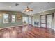 Bright bedroom features hardwood floors, ample natural light, and custom closet solutions at 2708 Port Of Call Dr, Las Vegas, NV 89128