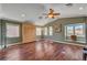 Spacious bedroom showcasing hardwood floors, abundant natural light, and a ceiling fan at 2708 Port Of Call Dr, Las Vegas, NV 89128