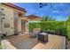 Outdoor deck featuring comfortable seating, a modern fire pit, and shade, perfect for outdoor relaxation at 2708 Port Of Call Dr, Las Vegas, NV 89128