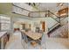 Elegant dining area with a stone staircase, modern furnishings, and ample natural light at 2708 Port Of Call Dr, Las Vegas, NV 89128