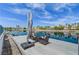 Dock seating area over the canal with an umbrella for shade and space for entertaining at 2708 Port Of Call Dr, Las Vegas, NV 89128