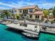 Backyard with dock, boat, outdoor seating, and a grill, perfect for waterfront living at 2708 Port Of Call Dr, Las Vegas, NV 89128