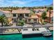 Aerial view showcasing the home's backyard, dock and waterfront location at 2708 Port Of Call Dr, Las Vegas, NV 89128