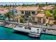 Back exterior view of home with dock, waterfront views, and patio space at 2708 Port Of Call Dr, Las Vegas, NV 89128