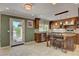 Spacious kitchen with custom cabinets, stainless appliances, and access to outdoor area at 2708 Port Of Call Dr, Las Vegas, NV 89128