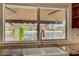 Bright kitchen with a double sink overlooking beautiful waterfront views at 2708 Port Of Call Dr, Las Vegas, NV 89128