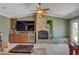 Stylish living room featuring a stone fireplace, custom cabinetry, and a relaxing ambiance at 2708 Port Of Call Dr, Las Vegas, NV 89128