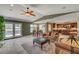 Inviting living area with an open layout, fireplace, and access to the kitchen at 2708 Port Of Call Dr, Las Vegas, NV 89128
