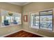 Bright living room with hardwood floors, seating area, and sliding door to the balcony with water views at 2708 Port Of Call Dr, Las Vegas, NV 89128