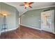 Spacious living room features hardwood floors, ceiling fan, and a glass door leading to the outside at 2708 Port Of Call Dr, Las Vegas, NV 89128