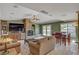 Cozy living room featuring a stone fireplace, built-in cabinets, and views of the water at 2708 Port Of Call Dr, Las Vegas, NV 89128