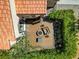 Aerial view of an outdoor patio featuring a fire pit, seating, and lush greenery at 2708 Port Of Call Dr, Las Vegas, NV 89128