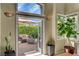 Inviting outdoor patio with a comfortable seating area, fire pit, and lush landscaping at 2708 Port Of Call Dr, Las Vegas, NV 89128