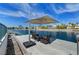 Dockside patio with modern seating provides a relaxing space, enhanced by the view of the lake at 2708 Port Of Call Dr, Las Vegas, NV 89128