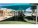 Community playground featuring slide, climbing bars and sunshade near waterfront at 2708 Port Of Call Dr, Las Vegas, NV 89128