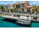 Beautiful waterfront property featuring a private dock with seating area and access to the water at 2708 Port Of Call Dr, Las Vegas, NV 89128