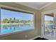 Inviting room with a stunning water view and door to balcony at 2708 Port Of Call Dr, Las Vegas, NV 89128