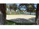 Outdoor sand volleyball and basketball court in a lush park setting by the lagoon at 2708 Port Of Call Dr, Las Vegas, NV 89128