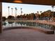 Community waterfront view from outdoor patio with palm trees and sunshades for residents at 2708 Port Of Call Dr, Las Vegas, NV 89128