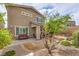 Exterior backyard view showcasing the patio, landscaping, and the home's facade at 2711 Evolutionary Ln, Las Vegas, NV 89138