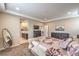 A comfortable bedroom featuring an ensuite bathroom, soft carpet, and warm neutral paint at 2711 Evolutionary Ln, Las Vegas, NV 89138