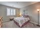 Comfortable bedroom with window shutters, stylish decor, and carpeted floors at 2711 Evolutionary Ln, Las Vegas, NV 89138