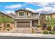 Charming two-story home with landscaped front yard and a two-car garage in a desirable neighborhood at 2711 Evolutionary Ln, Las Vegas, NV 89138