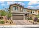 Beautiful two-story home with a well-manicured lawn and inviting curb appeal in a quiet neighborhood at 2711 Evolutionary Ln, Las Vegas, NV 89138