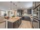 Gourmet kitchen features stainless steel appliances, granite countertops and custom cabinetry at 2711 Evolutionary Ln, Las Vegas, NV 89138
