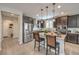 Kitchen with a center island, stainless steel appliances, and dark cabinets at 2711 Evolutionary Ln, Las Vegas, NV 89138