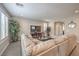 Inviting living room featuring a large sectional couch, hardwood floors, and neutral paint at 2711 Evolutionary Ln, Las Vegas, NV 89138