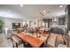 Open-concept living room and dining area with hardwood floors and plenty of natural light at 2711 Evolutionary Ln, Las Vegas, NV 89138
