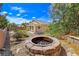 Backyard features a fire pit and low-maintenance desert landscaping at 2713 Rue Toulouse Ave, Henderson, NV 89044