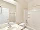 Clean bathroom featuring a vanity, toilet, and a shower-tub combo with white tile surround at 2713 Rue Toulouse Ave, Henderson, NV 89044