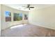 Large primary bedroom boasting multiple windows, neutral walls, and a ceiling fan at 2713 Rue Toulouse Ave, Henderson, NV 89044