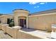 Inviting front entry with decorative turret, covered porch, and well-maintained landscaping at 2713 Rue Toulouse Ave, Henderson, NV 89044