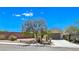 Charming single-story home with desert landscaping, mature tree, and a two-car garage at 2713 Rue Toulouse Ave, Henderson, NV 89044