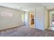 Comfortable living room with cozy carpet flooring and views into the kitchen area at 2713 Rue Toulouse Ave, Henderson, NV 89044