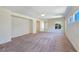 Large living room with plush carpeting and plenty of natural light from surrounding windows at 2713 Rue Toulouse Ave, Henderson, NV 89044