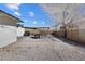 Low-maintenance backyard with a patio, grill, and rock landscape, offering easy outdoor living at 2724 Spear St, North Las Vegas, NV 89030