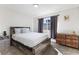 Serene bedroom features neutral decor, plush carpet, and ample natural light at 2724 Spear St, North Las Vegas, NV 89030