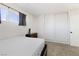 Bright bedroom featuring a minimalist design with natural light, carpet, and closet at 2724 Spear St, North Las Vegas, NV 89030