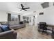Spacious living room with hardwood floors, a modern ceiling fan, and an open floor plan at 2724 Spear St, North Las Vegas, NV 89030