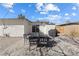 Outdoor patio area with dining set, grill, and decorative gravel landscaping at 2724 Spear St, North Las Vegas, NV 89030