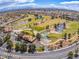 Stunning aerial view of the community golf course with lush green fairways, mature trees, and water features at 2740 Billy Casper Dr, Las Vegas, NV 89134