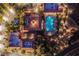 Aerial view of a community clubhouse with a pool, tennis courts, lush landscaping, and elegant architectural design at 2740 Billy Casper Dr, Las Vegas, NV 89134