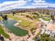 Breathtaking aerial view showcasing golf course, water features, mature trees, and beautiful single-Gathering homes at 2740 Billy Casper Dr, Las Vegas, NV 89134