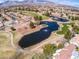 Expansive aerial view of the golf course showcasing lush landscaping, water features, and beautiful single-Gathering homes at 2740 Billy Casper Dr, Las Vegas, NV 89134